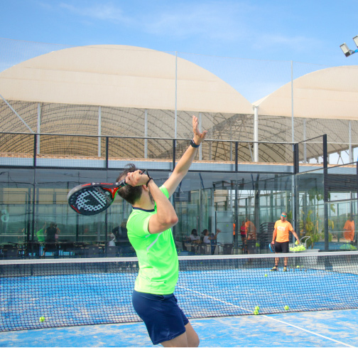 Protour player hitting the ball on a padel court